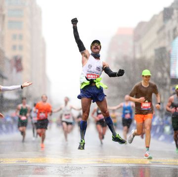 boston, massachusetts april 17 fernando ferreira celebrates in the rain as he crosses the finish line during the 127th boston marathon on april 17, 2023 in boston, massachusetts photo by maddie meyergetty images