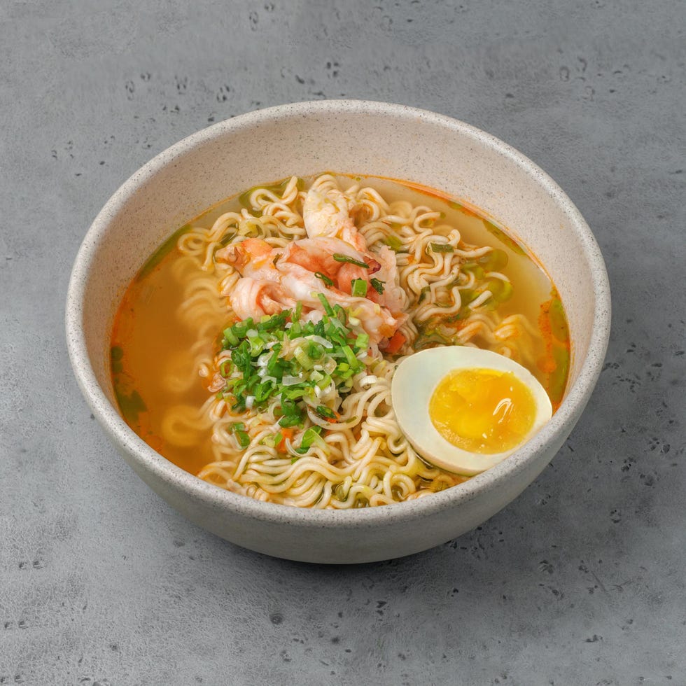 asian instant noodle with shrimps on gray background