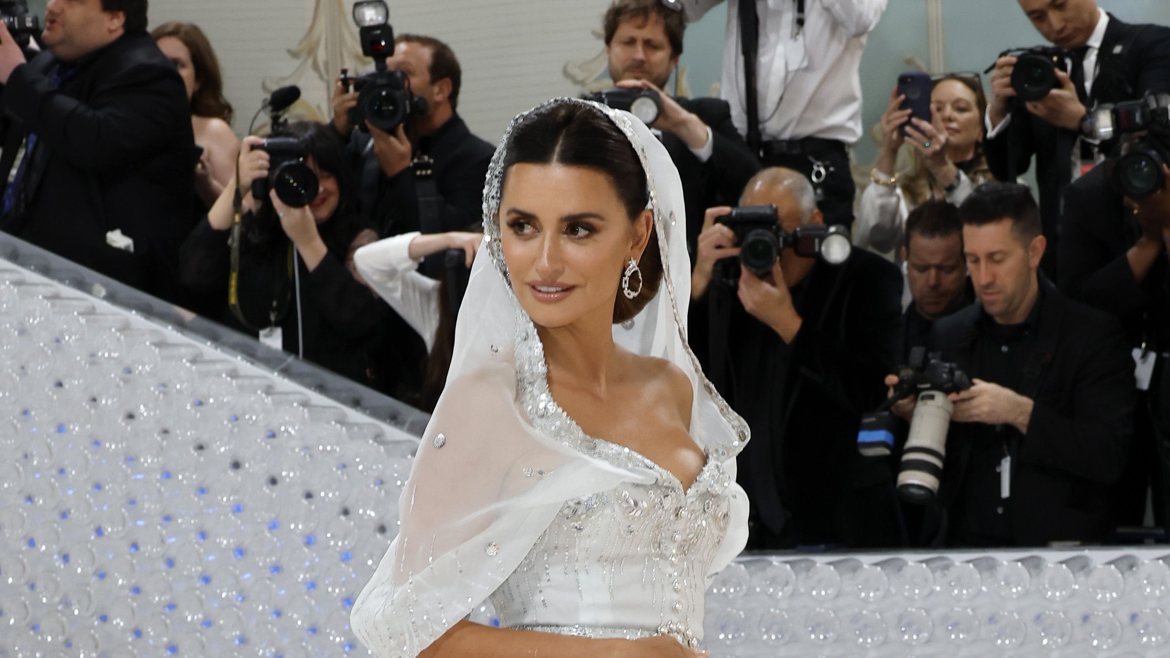 Penélope Cruz cuts a VERY stylish figure in Chanel as she jets out of  Venice