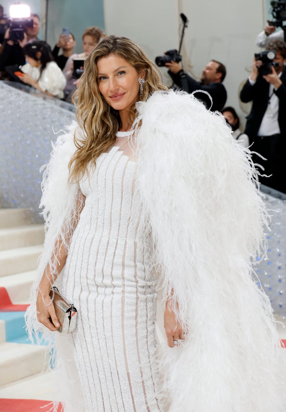 Gisele Bündchen Wore an Extremely Long Feathered Cape to the 2025 Met Gala