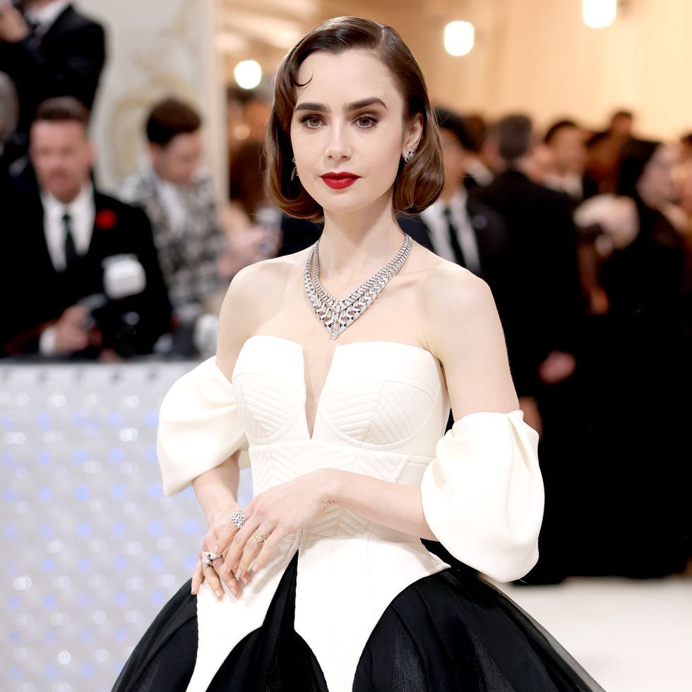a person in a white dress, lily collins at met gala