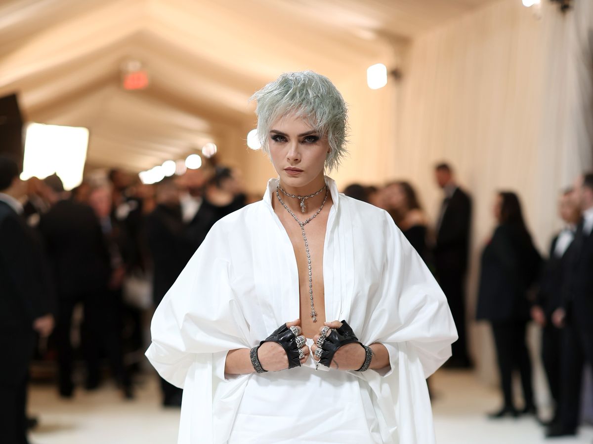 Cara Delevingne Wears High-Low Dress and Leg Gloves at 2023 Met Gala