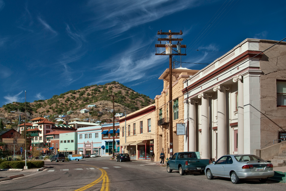 a street with cars and buildings on the side