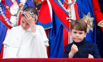 london, united kingdom may 06: (embargoed for publication in uk newspapers until 24 hours after create date and time) princess charlotte of wales and prince louis of wales watch an raf flypast from the balcony of buckingham palace following the coronation of king charles iii  queen camilla at westminster abbey on may 6, 2023 in london, england. the coronation of charles iii and his wife, camilla, as king and queen of the united kingdom of great britain and northern ireland, and the other commonwealth realms takes place at westminster abbey today. charles acceded to the throne on 8 september 2022, upon the death of his mother, elizabeth ii. (photo by max mumby/indigo/getty images)