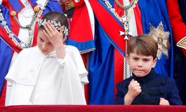 london, united kingdom may 06: (embargoed for publication in uk newspapers until 24 hours after create date and time) princess charlotte of wales and prince louis of wales watch an raf flypast from the balcony of buckingham palace following the coronation of king charles iii  queen camilla at westminster abbey on may 6, 2023 in london, england. the coronation of charles iii and his wife, camilla, as king and queen of the united kingdom of great britain and northern ireland, and the other commonwealth realms takes place at westminster abbey today. charles acceded to the throne on 8 september 2022, upon the death of his mother, elizabeth ii. (photo by max mumby/indigo/getty images)