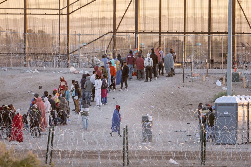 el paso, texas may 12 immigrants wait to be transported and processed by us border patrol officers at the us mexico border on may 12, 2023 in el paso, texas the us covid era title 42 immigration policy ended the night before, and migrants entering the system now are anxious over how the change may affect their asylum claims photo by john mooregetty images