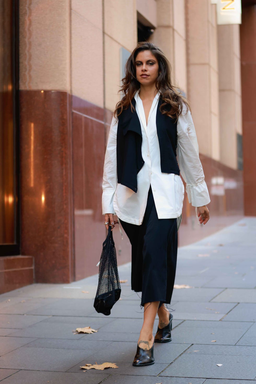 sydney, australia may 19 mimi elashiry wearing black vest, white shirt and black skirt at afterpay australian fashion week 2023 at carriageworks on may 19, 2023 in sydney, australia photo by hanna lassengetty images