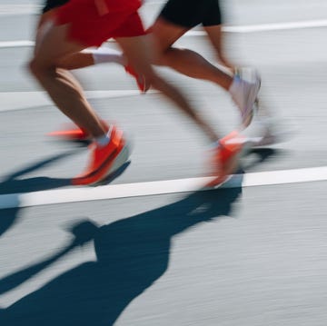 low section people running fast in the city, defocused sports background low section people running fast in the city, defocused sports background