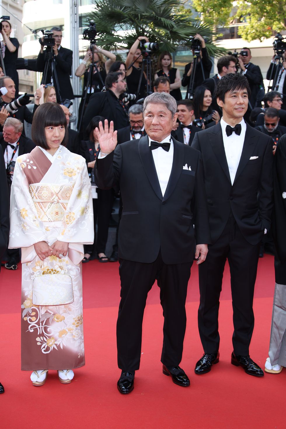 cannes, france may 23 guest, takeshi kitano, and hidetoshi nishijima attend the asteroid city red carpet during the 76th annual cannes film festival at palais des festivals on may 23, 2023 in cannes, france photo by daniele venturelliwireimage
