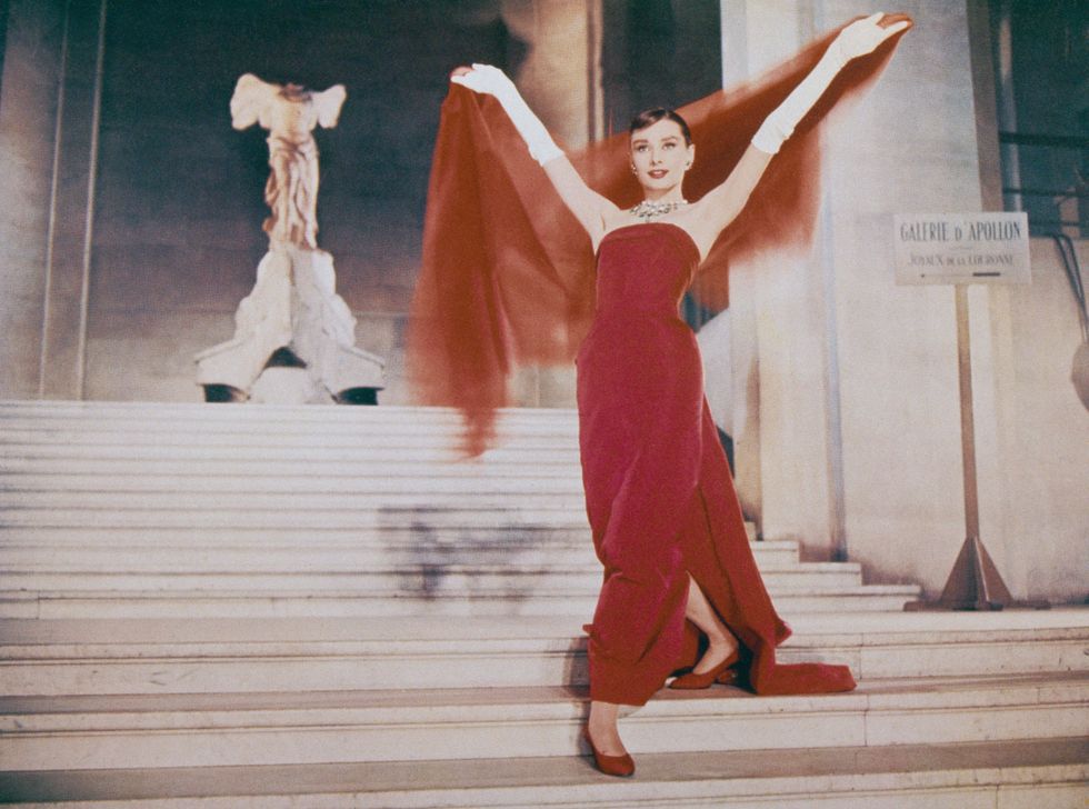 actress audrey hepburn 1929   1993 descends the daru staircase at the louvre in paris, in a scene from the film 'funny face', 1957 the ancient marble sculpture of the winged victory of samothrace is visible at the top of the stairs photo by archive photosgetty images
