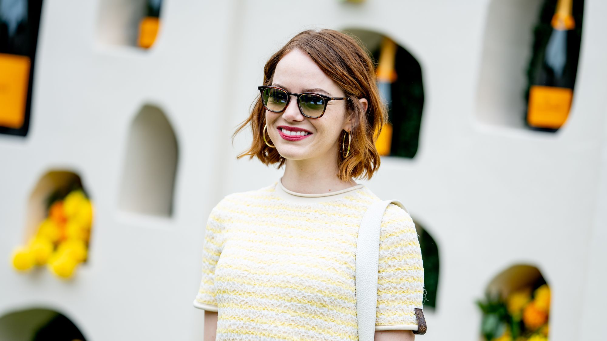 See Emma Stone Look Effortlessly Chic in a Yellow Top and Tiered Skirt