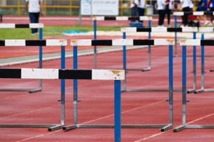 synthetic running track for sporting events with hurdles