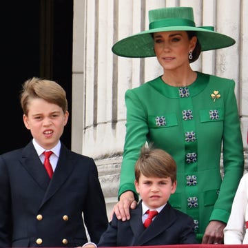 Trooping The Colour 2023 london, england june 17 prince george of wales, prince louis of wales, catherine, princess of wales, princess charlotte of wales and prince william, prince of wales stand on the balcony of buckingham palace to watch a fly past of aircraft by the royal air force during trooping the colour on june 17, 2023 in london, england trooping the colour is a traditional parade held to mark the british sovereigns official birthday it will be the first trooping the colour held for king charles iii since he ascended to the throne photo by karwai tangwireimage
