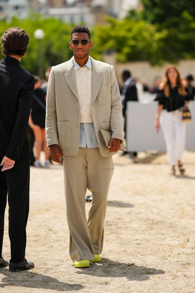 paris, france june 23 a guest wears black sunglasses, a pale blue shirt, a white latte braided wool gilet, a beige blazer jacket, matching beige suit pants, neon yellow felt shoes , outside dior, during the menswear springsummer 2024 as part of paris fashion week on june 23, 2023 in paris, france photo by edward berthelotgetty images