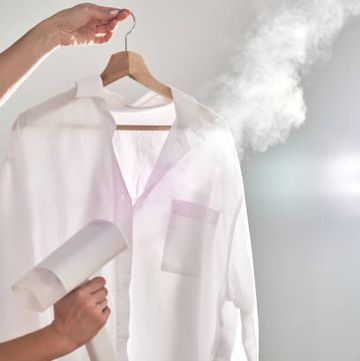 clothes steamer vs iron image of steaming a shirt