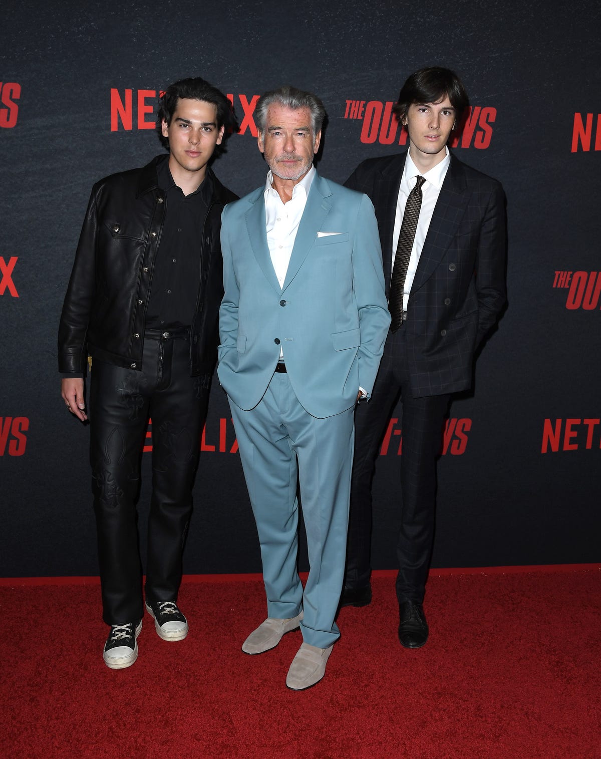 Pierce Brosnan attends premiere with two sons, Dylan and Paris