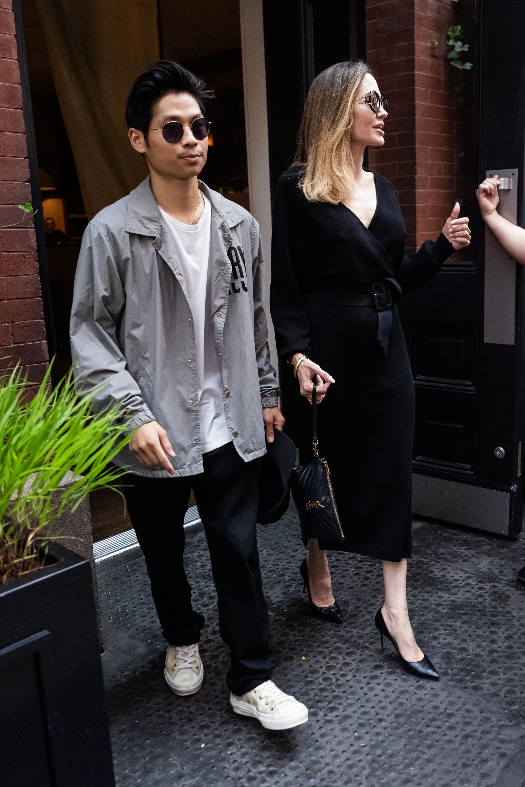 Angelina Jolie looks classy as ever in black pantsuit while stepping out  for a business meeting with her son Pax in New York City-160834_8