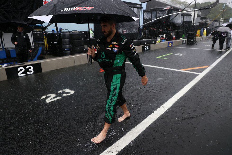 chicago, illinois july 02 a pit crew member of the 3 get bioethanol chevrolet, walks pit road under an umbrella prior to the nascar cup series grant park 220 at the chicago street course on july 02, 2023 in chicago, illinois photo by chris graythengetty images