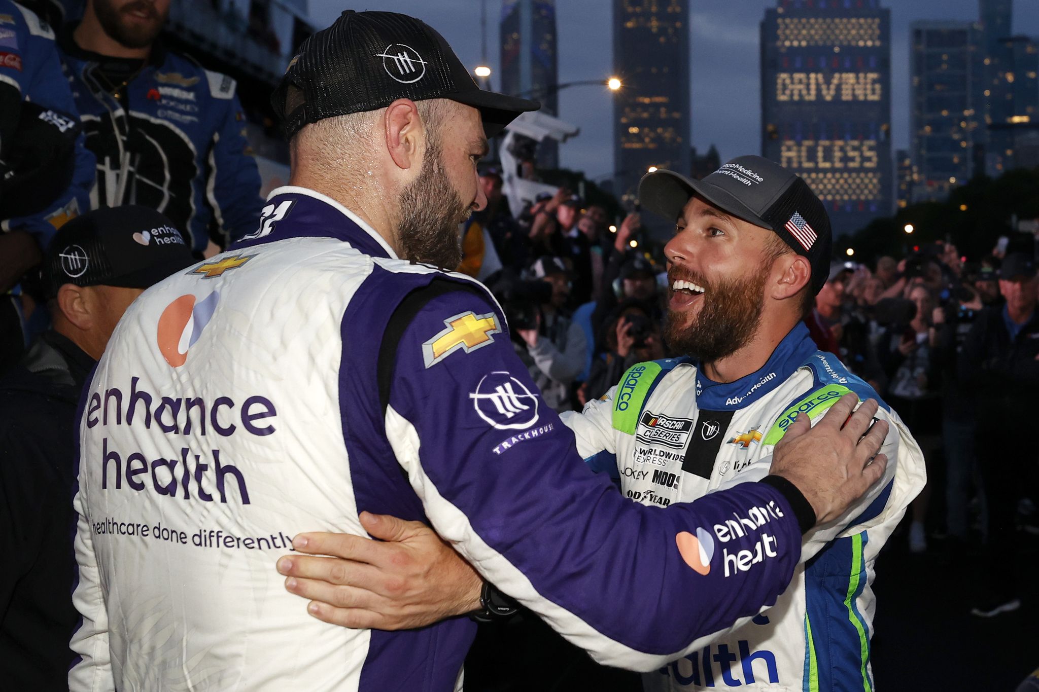 chicago, illinois july 02 shane van gisbergen, driver of the 91 enhance health chevrolet, is congratulated by ross chastain, driver of the 1 adventhealth chevrolet, r victory lane after winning the nascar cup series grant park 220 at the chicago street course on july 02, 2023 in chicago, illinois photo by chris graythengetty images
