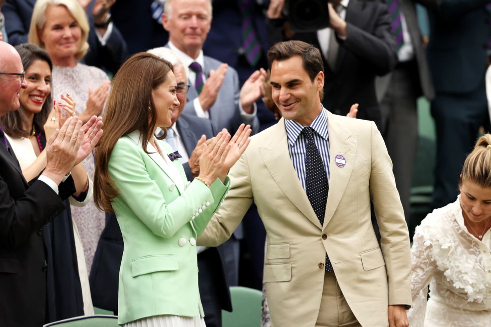london, england july 04 former wimbledon champion, roger federer of switzerland interacts with catherine, princess of wales as he is honoured in the royal box prior to the womens singles first round match between shelby rogers of united states and elena rybakina of kazakhstan during day two of the championships wimbledon 2023 at all england lawn tennis and croquet club on july 04, 2023 in london, england photo by clive brunskillgetty images