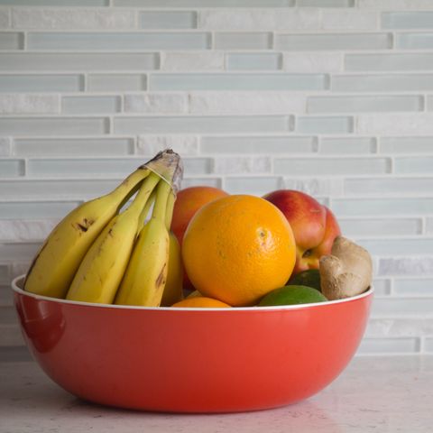 Fresh fruit in red bowl