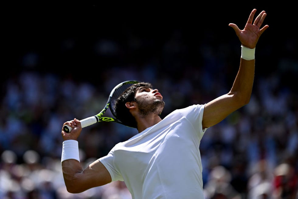 london, england july 07: carlos alcaraz of spain serves against alexandre muller of france in the mens singles second round match during day five of the championships wimbledon 2023 at all england lawn tennis and croquet club on july 07, 2023 in london, england. (photo by shaun botterill/getty images)