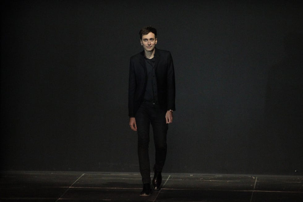 hedi slimane walks the runway during the saint laurent spring summer 2013 show