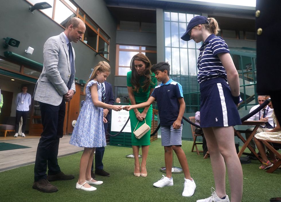 l r britains prince william, britains princess charlotte of wales, britains prince george of wales, prince of wales and britains catherine, princess of wales speak to muawwiz anwar centre right who will perform the mens singles final coin toss at the all england lawn tennis club in wimbledon, southwest london, on july 16, 2023 ahead of the mens singles final tennis match on the fourteenth day of the 2023 wimbledon championships photo by victoria jones pool afp restricted to editorial use photo by victoria jonespoolafp via getty images
