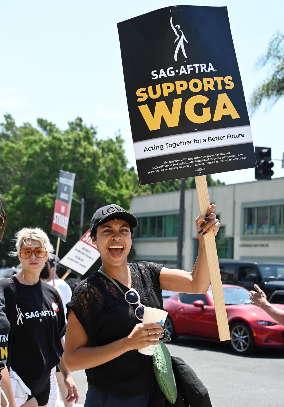 rosario dawson walks the picket line on day 5 in support of the sag aftra and wga strike at paramount pictures studio on july 17, 2023 in los angeles, california photo by gilbert floresvariety via getty images