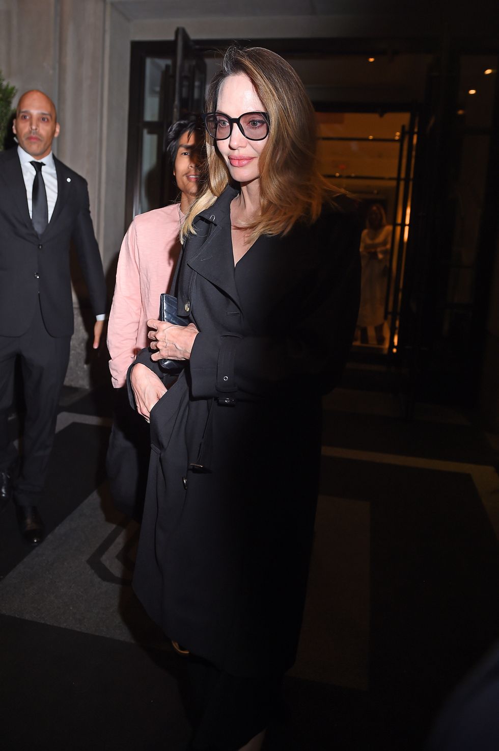 Angelina Jolie Can’t Stop Wearing This Sleek Black Trench Coat