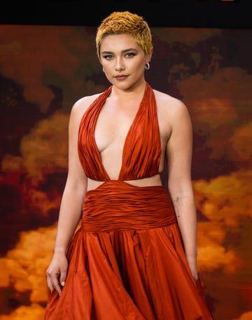 florence pugh coordinated her fiery hair with hip grazing cut out gown