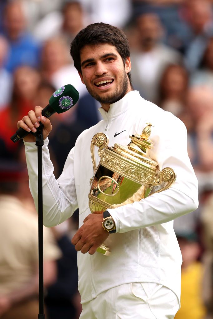 london, england july 16 carlos alcaraz of spain is interviewed with the mens singles trophy following his victory in the mens singles final against novak djokovic of serbia on day fourteen of the championships wimbledon 2023 at all england lawn tennis and croquet club on july 16, 2023 in london, england photo by julian finneygetty images