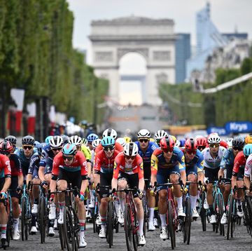 the pack cycles on the champs elysee avenue with the arc de triomphe in the background during the 21st and final stage of the 110th edition of the tour de france cycling race, 115 km between saint quentin en yvelines and the champs elysees in paris, on july 23, 2023 photo by marco bertorello  afp photo by marco bertorelloafp via getty images