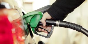 Green, Filling station, Bicycle handlebar, Hand, Gasoline, Vacuum cleaner, Plant, Machine, Business, Vehicle, 