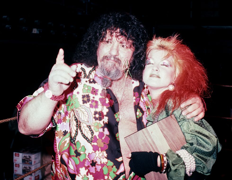 Lou Albano and Cyndi Lauper attend the Ugliest Bartender Contest Benefiting the Multiple Sclerosis Society on December 11, 1984, at Studio 54 in New York City