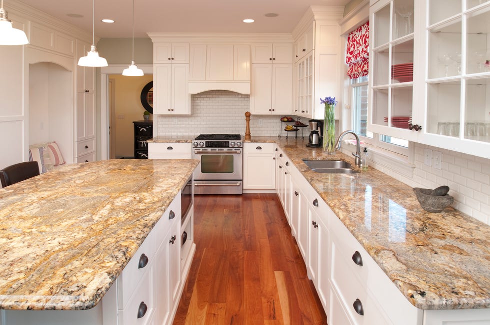 The kitchen features granite countertops, electric appliances, and