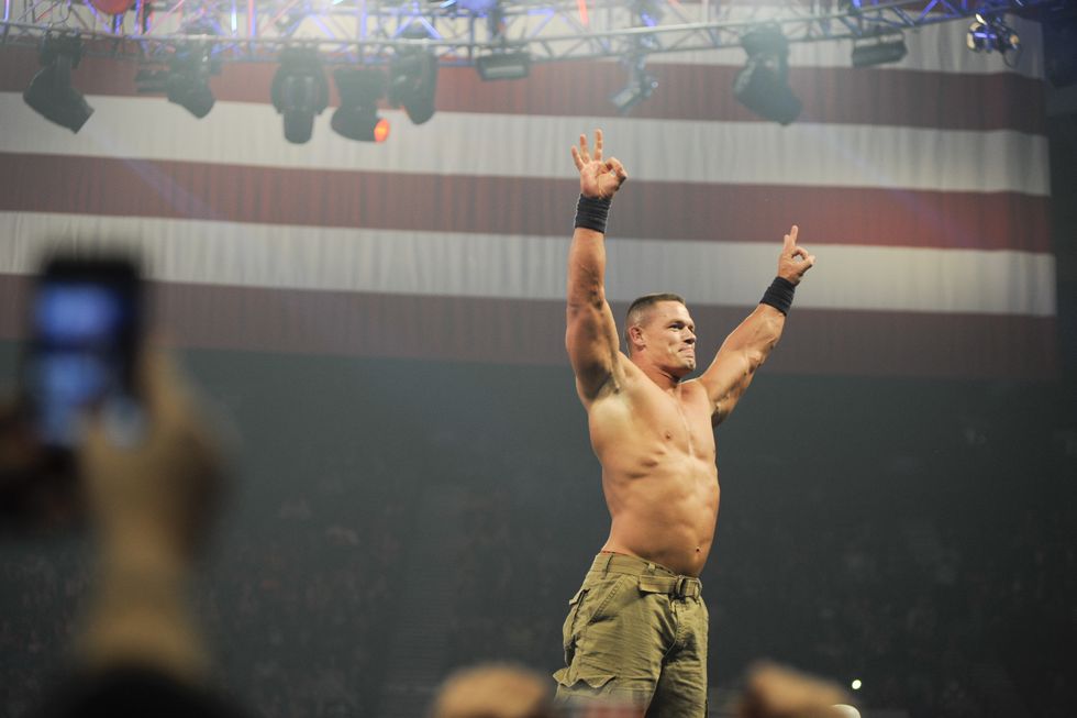 john cena performs during the 10th anniversary of wwe tribute to the troops at norfolk scope arena in norfolk, virginia on december 9, 2012
