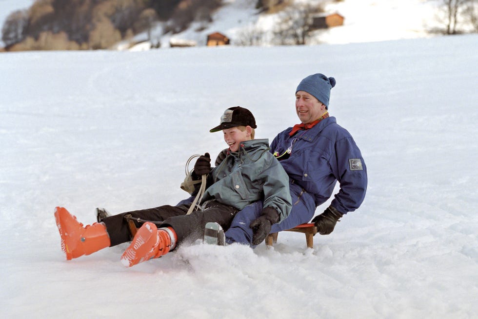 prince charles, and prince harry sledging during a ski holiday in klosters, switzerland