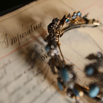 a picture taken on december 18, 2012 shows a 1860 tiara with removable 7 pin drags made of diamonds, turquoise and gold on silver, displayed on a page order of empress eugenie, the wife of napoleon iii, emperor of the french, in the mellerio jewelry store in paris founded in 1613, french jewelry house mellerio is the oldest family owned company in europe and has been making the fifa ballon dor trophy since 1956    afp photo  franck fife        photo credit should read franck fifeafp via getty images