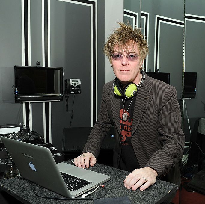 musician andy rourke djing at an event