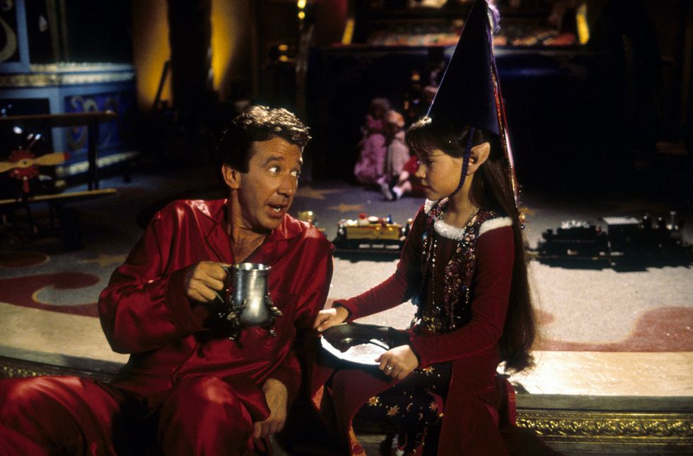 tim allen with paige tamada as an elf in a scene from the film the santa clause, 1994 photo by walt disney picturesgetty images
