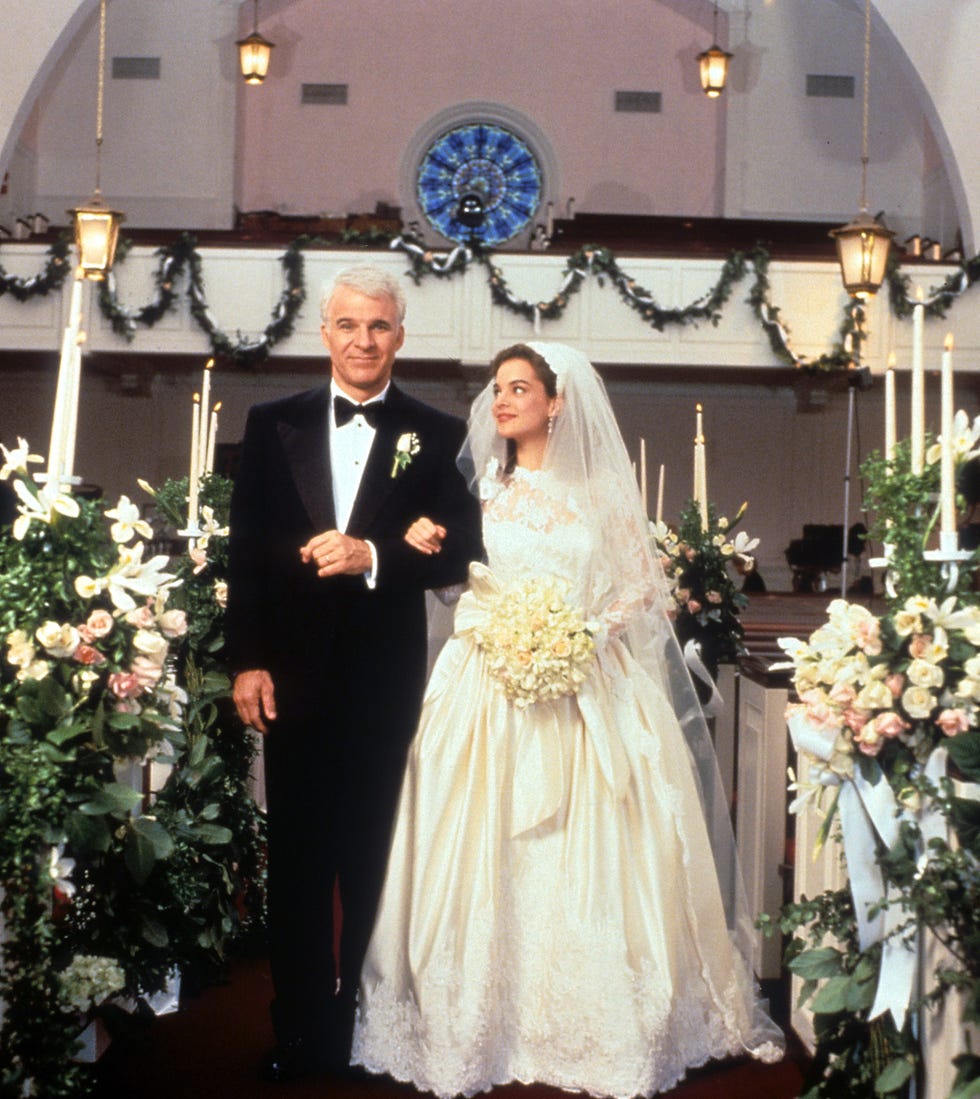 steve martin walking down the aisle with kimberly williams paisley in a scene from the film father of the bride, 1991. (photo by touchstone/getty images)