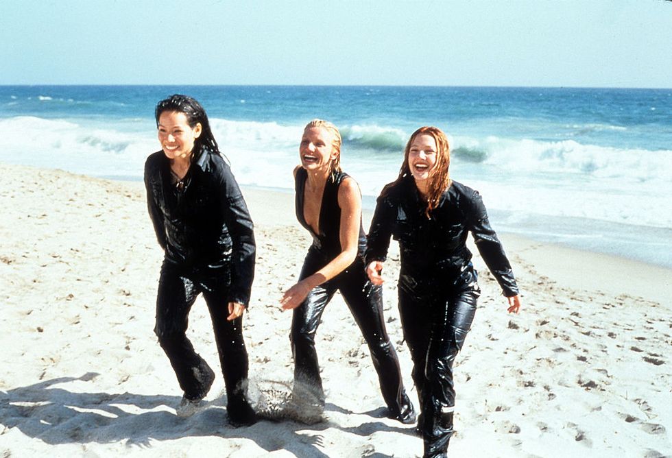 cameron diaz, drew barrymore and lucy liu walking up the sand of a beach in a scene from the film charlies angels, 2000 photo by columbia picturesgetty images