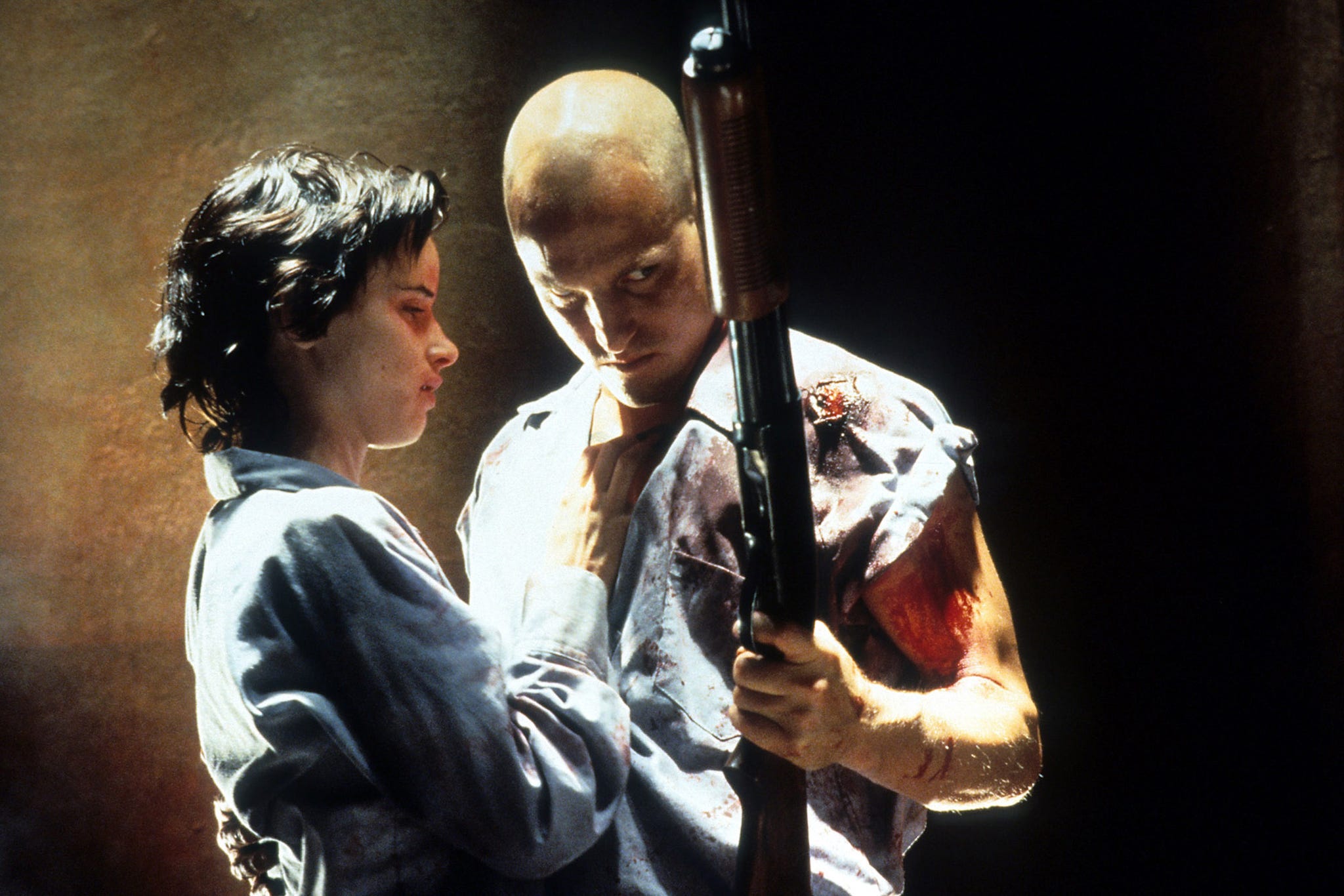 juliette lewis stands with woody harrelson who holds a gun in a scene from the film 'natural born killers', 1994 photo by warner brothersgetty images