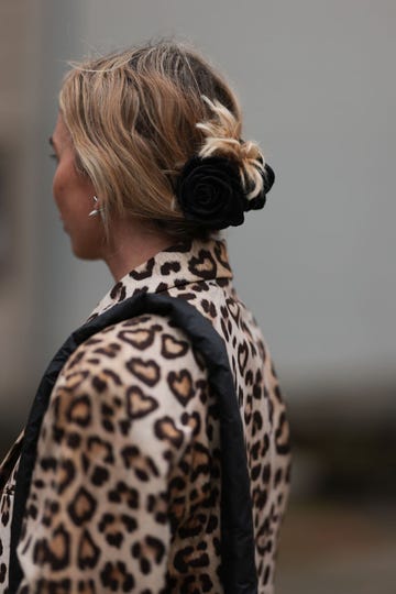 copenhagen, denmark august 09 karin teigl seen wearing hm beige brown leopard pattern long coat, black rose hair clip, vee collective black nylon crossbody bag, during the copenhagen fashion week springsummer 2024 on august 09, 2023 in copenhagen, denmark photo by jeremy moellergetty images