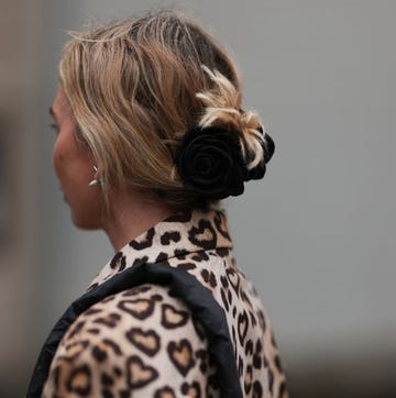 Street Style - Day 3 - Copenhagen Fashion Week Spring/Summer 2024 copenhagen, denmark august 09 karin teigl seen wearing hm beige brown leopard pattern long coat, black rose hair clip, vee collective black nylon crossbody bag, during the copenhagen fashion week springsummer 2024 on august 09, 2023 in copenhagen, denmark photo by jeremy moellergetty images