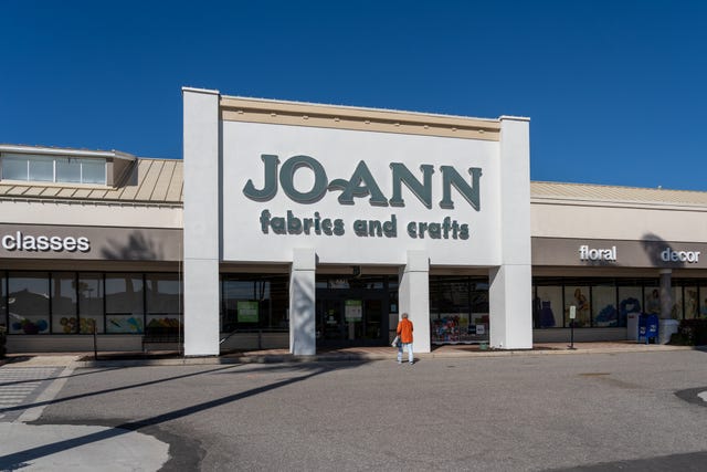 sarasota, florida, usa january 11, 2022: a woman walking into the joann fabrics and crafts store in sarasota, florida, usa. jo ann is an american specialty retailer of crafts and fabrics.