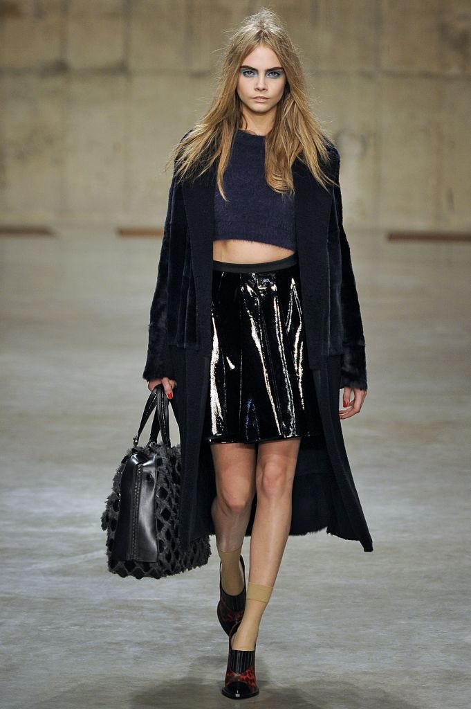 london, england february 17: cara delevingne walks the runway during the unique ready to wear fall/winter 2013 2014 show as part of the london fashion week fall/winter 2013/14 at topshop show space on february 17, 2013 in london, england. (photo by victor virgile/gamma rapho via getty images)