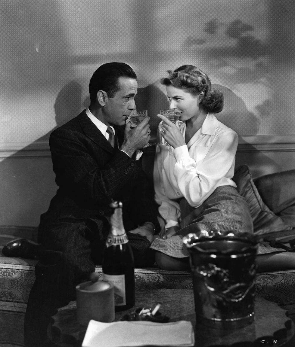 humphrey bogart and ingrid bergman sharing champagne in a scene from the film 'casablanca', 1942 photo by warner brothersgetty images