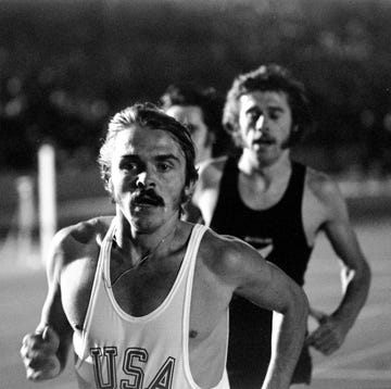 steve prefontaine wearing a usa vest and running ahead of other athletes on a track steve prefontaine wearing a usa vest and running ahead of other athletes on a track
